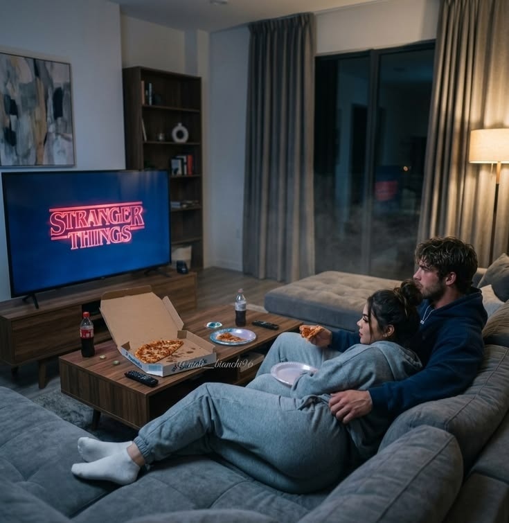 Couple watching a series on a smart TV with a premium IPTV subscription