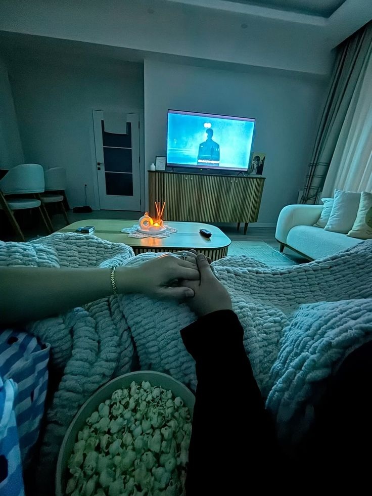 Cozy evening with popcorn watching 4K IPTV channels with zero buffering